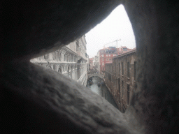 The Ponte de la Canonica bridge over the Rio de Palazzo o de Canonica canal, viewed from a grated window in the Ponte dei Sospiri bridge