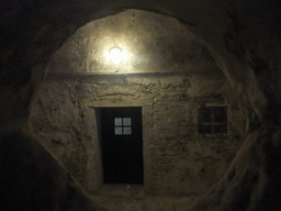 Door and window of a cell at the Prigioni Nuove prison, viewed through a hole in the wall