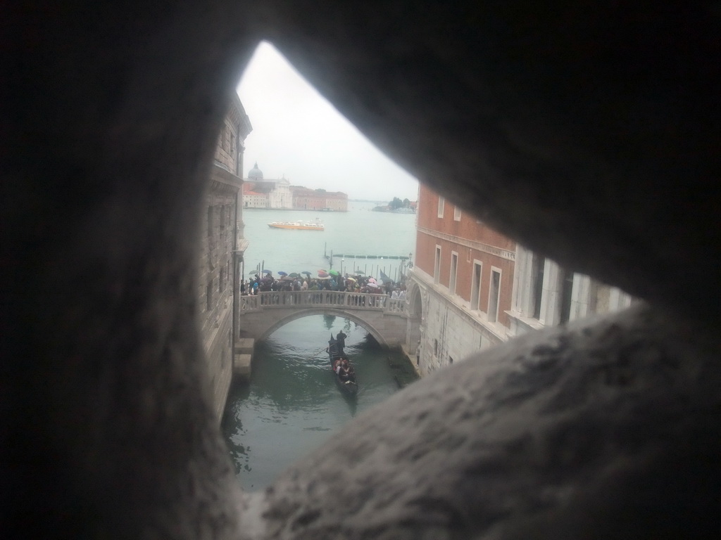 The Ponte della Paglia bridge over the Rio de Palazzo o de Canonica canal, the Bacino di San Marco basin and the Basilica di San Giorgio Maggiore church, viewed from a grated window in the Ponte dei Sospiri bridge