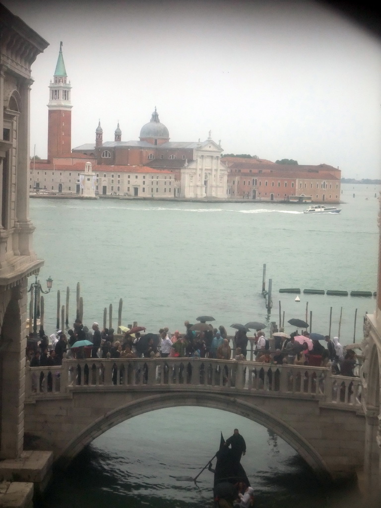 The Ponte della Paglia bridge over the Rio de Palazzo o de Canonica canal, the Bacino di San Marco basin and the Basilica di San Giorgio Maggiore church, viewed from a grated window in the Ponte dei Sospiri bridge