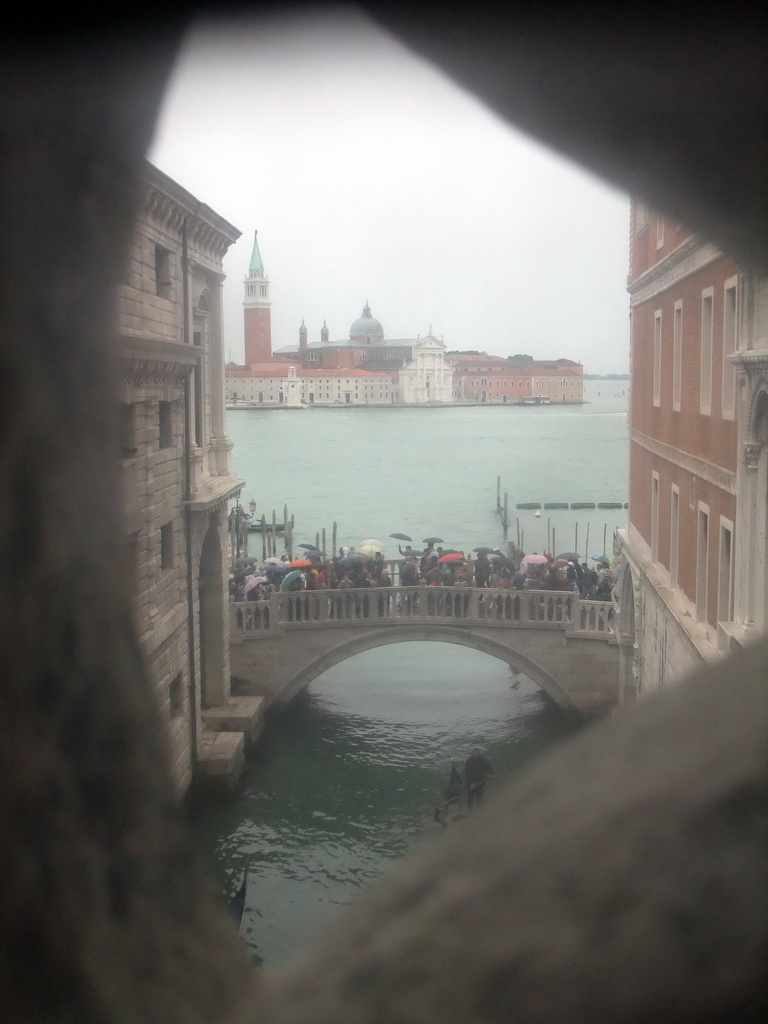 The Ponte della Paglia bridge over the Rio de Palazzo o de Canonica canal, the Bacino di San Marco basin and the Basilica di San Giorgio Maggiore church, viewed from a grated window in the Ponte dei Sospiri bridge