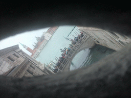 The Ponte della Paglia bridge over the Rio de Palazzo o de Canonica canal, the Bacino di San Marco basin and the Basilica di San Giorgio Maggiore church, viewed from a grated window in the Ponte dei Sospiri bridge