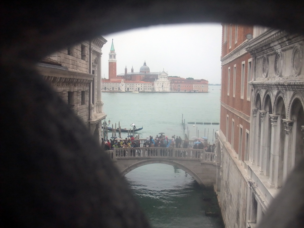 The Ponte della Paglia bridge over the Rio de Palazzo o de Canonica canal, the Bacino di San Marco basin and the Basilica di San Giorgio Maggiore church, viewed from a grated window in the Ponte dei Sospiri bridge