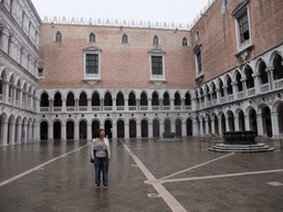 Miaomiao at the Courtyard of the Palazzo Ducale palace with its two wells