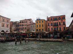 Market stalls at the Campo della Pescaria square, viewed from the Canal Grande ferry