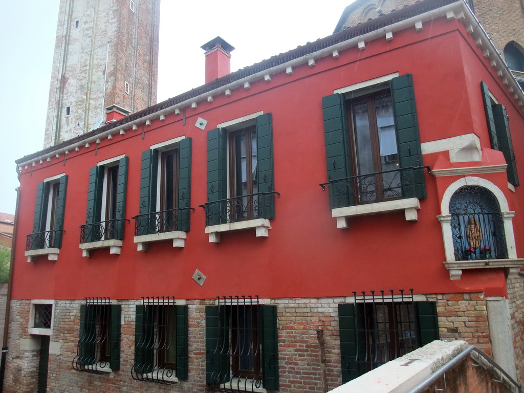 Building at the Calle Pazienza street and the Campanile tower of the Santa Maria dei Carmini church, viewed from the Ponte de la Pazienze bridge over the Rio de San Barnaba river