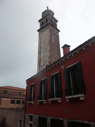 Building at the Calle Pazienza street and the Campanile tower of the Santa Maria dei Carmini church, viewed from the Ponte de la Pazienze bridge over the Rio de San Barnaba river