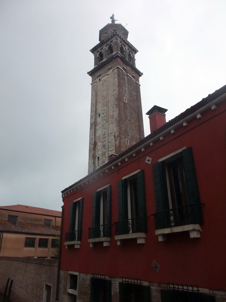 Building at the Calle Pazienza street and the Campanile tower of the Santa Maria dei Carmini church, viewed from the Ponte de la Pazienze bridge over the Rio de San Barnaba river