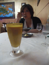 Miaomiao having dessert and a mango lassi at the Ristorante Indiano Maharani restaurant in Mestre