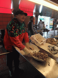 Merchant selling snails at the fish market at the Mercato del Pesce al Minuto building