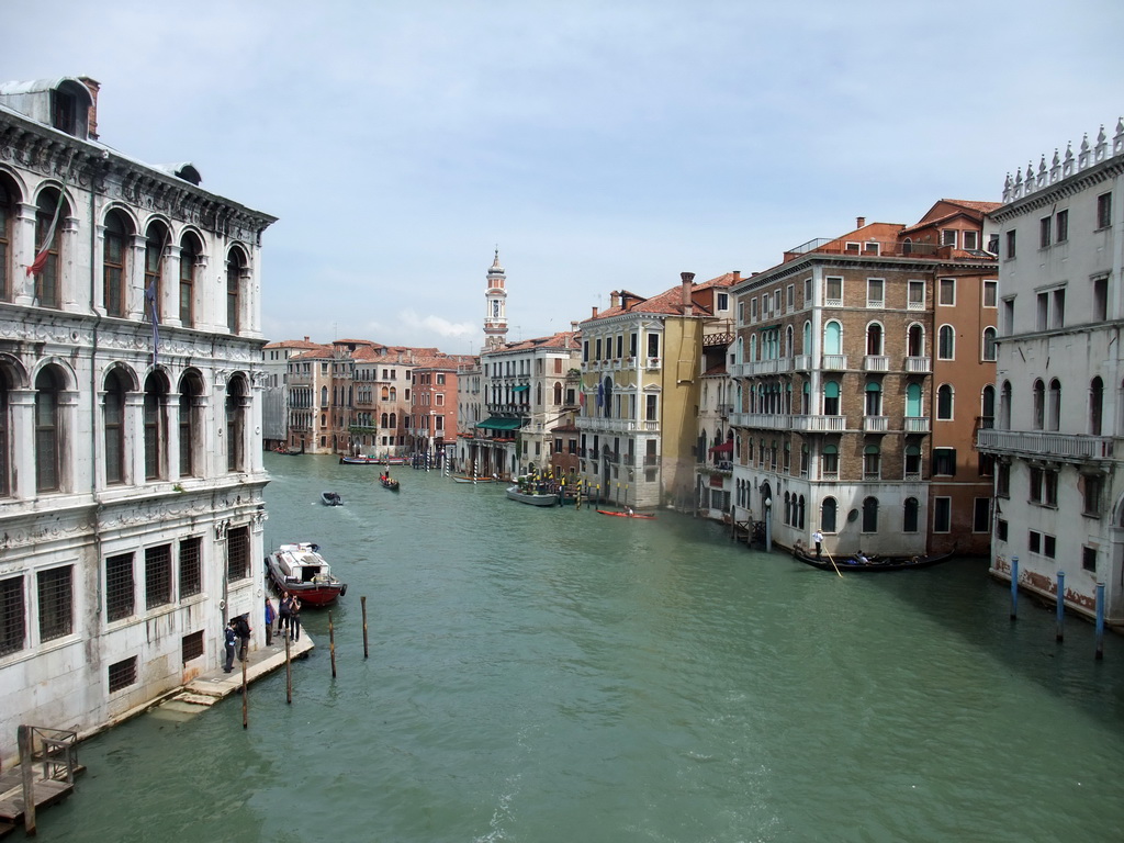 Boats in the north side of the Canal Grande and the Campanile tower of the Chiesa dei Santi Apostoli di Cristo church, viewed from the Ponte di Rialto bridge