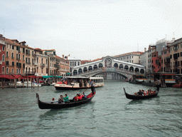 Gondolas and the Ponte di Rialto bridge over the Canal Grande, viewed from the Canal Grande ferry