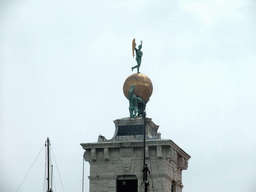 Sculpture on top of the Dogana da Mar building at the Punta della Dogana point, viewed from the ferry to the Lido di Venezia island