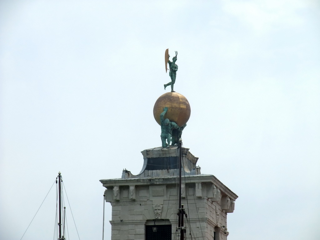 Sculpture on top of the Dogana da Mar building at the Punta della Dogana point, viewed from the ferry to the Lido di Venezia island
