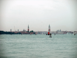 The Bacino di San Marco basin, the city center with the Campanile tower of the Basilica di San Marco church and the San Giorgio Maggiore island with the Basilica di San Giorgio Maggiore church, viewed from the ferry from the Lido di Venezia island