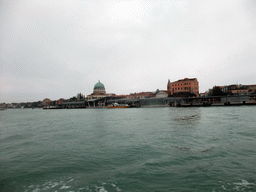 Docks and the Chiesa di Santa Maria della Vittoria church at the Lido di Venezia island, viewed from the ferry to the city center
