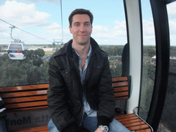 Tim in the Floriadebaan funicular, with a view on the Floriade park