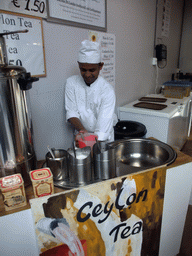 Man making Ceylon Tea in the pavilion of Sri Lanka at the World Show Stage section