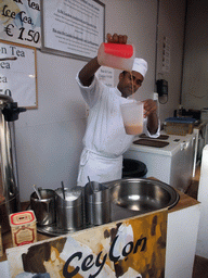 Man making Ceylon Tea in the pavilion of Sri Lanka at the World Show Stage section