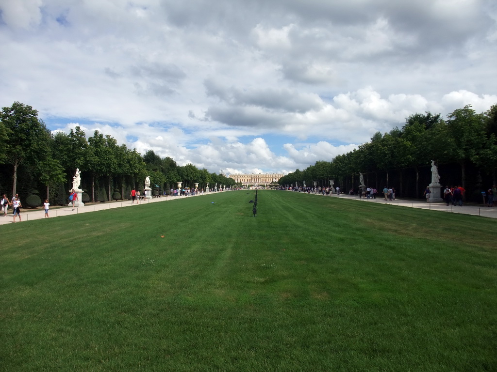 The Tapis Vert lawn in the Gardens of Versailles and the back side of the Palace of Versailles