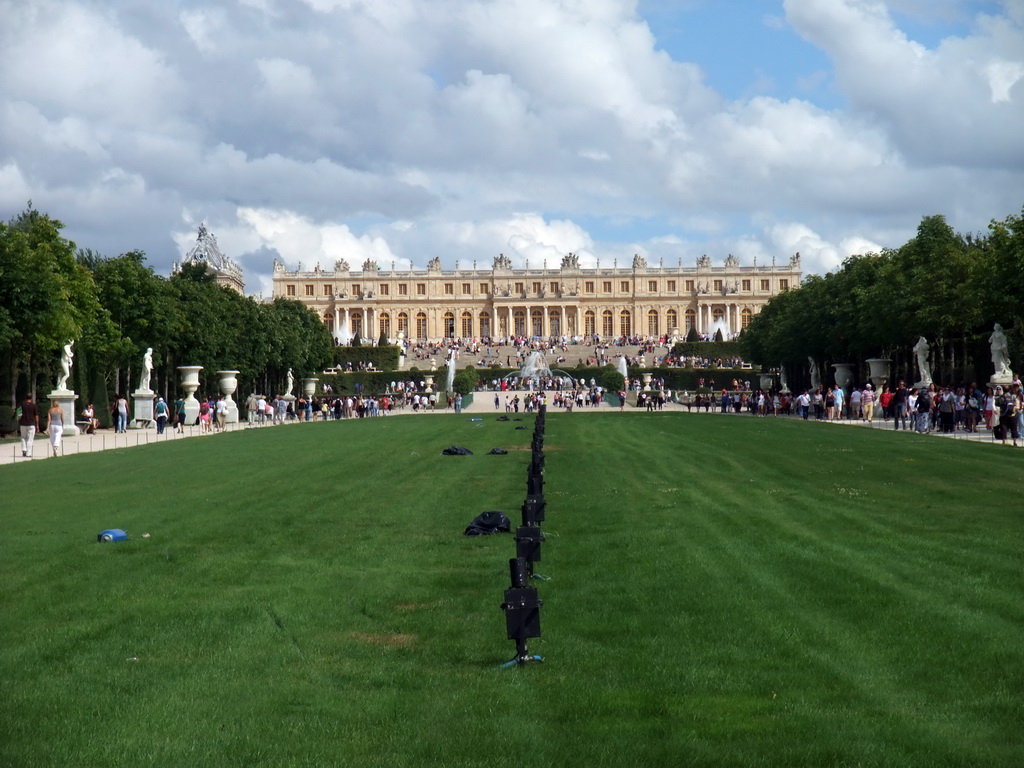 The Tapis Vert lawn, the Bassin de Latone fountain and both Bassin des Lézards fountains in the Gardens of Versailles and the back side of the Palace of Versailles