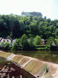 The Vianden Castle, a small dam in the Our river and the Rue du Vieux Marche street, viewed from the Rue Victor Hugo street