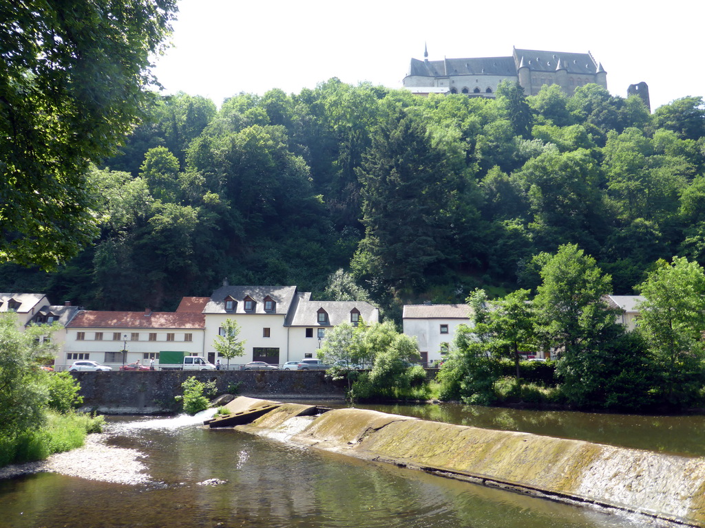 The Vianden Castle, a small dam in the Our river and the Rue du Vieux Marche street, viewed from the Rue Victor Hugo street