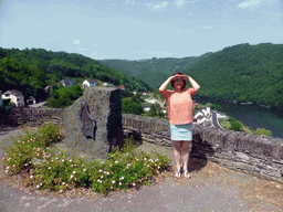 Miaomiao at a viewpoint next to the N10 road, with a view on the town of Bivels and the Our river