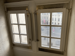 Window at the staircase from the third to the fourth floor of the Benediktushaus im Schottenstift hotel, with a view on the Freyung square