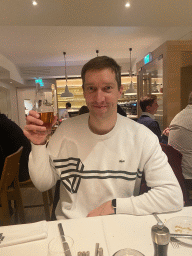 Tim with an Ottakringer beer at the Plachuttas Gasthaus zur Oper restaurant