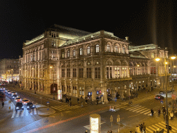 The northwest side of the Wiener Staatsoper building, viewed from the front of the Albertina museum, by night