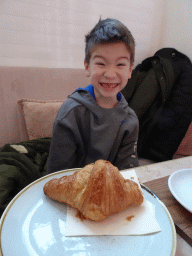Max with a croissant at the Vanillas Wien restaurant