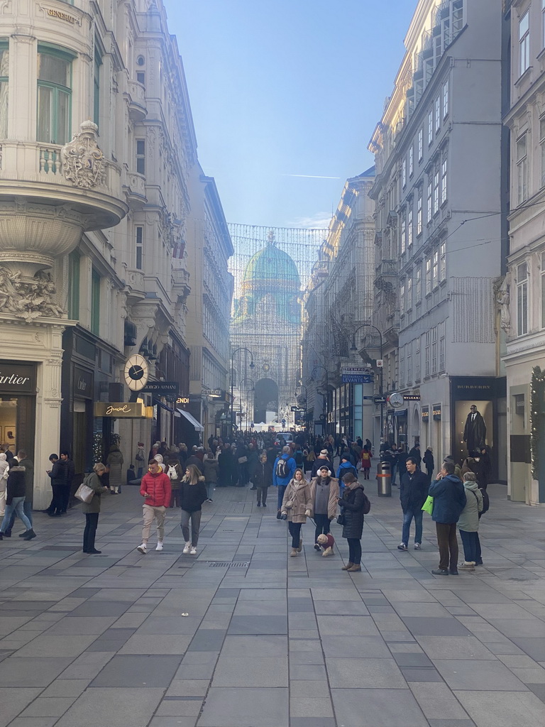 The Kohlmarkt street and the front and dome of the Hofburg palace