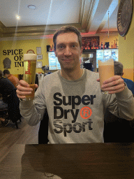 Tim with a Murauer beer and a mango lassi at the Spice of India restaurant