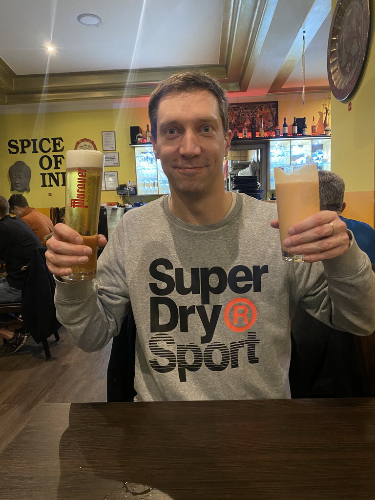 Tim with a Murauer beer and a mango lassi at the Spice of India restaurant