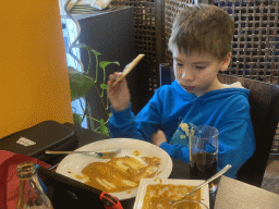 Max eating curry at the Spice of India restaurant
