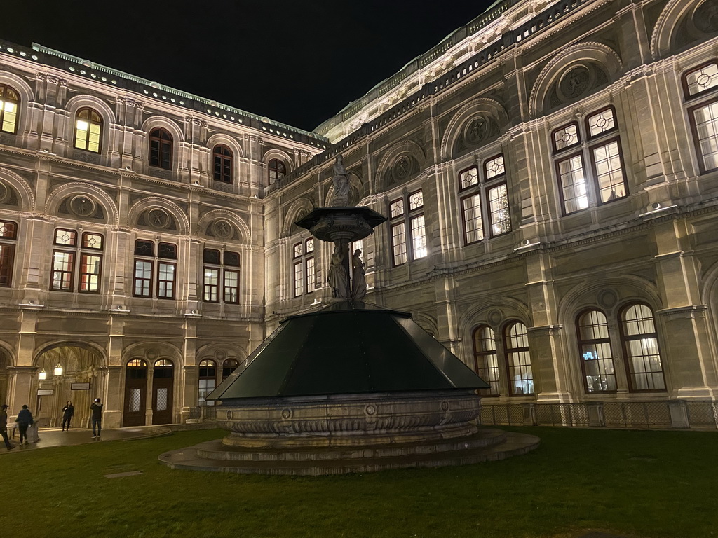 Opernbrunnen fountain at the southwest side of the Wiener Staatsoper building at the Operngasse street, by night