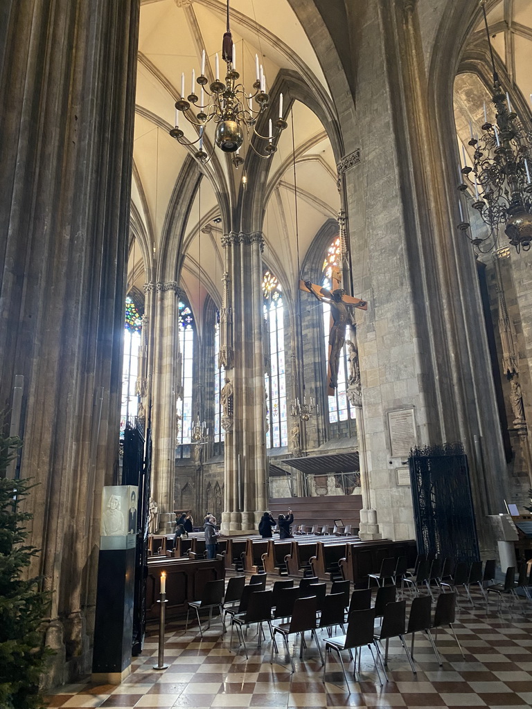 Nave with hanging cross at St. Stephen`s Cathedral, viewed from the north aisle