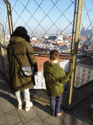 Miaomiao and Max at the viewing platform at the North Tower of St. Stephen`s Cathedral, with a view on the north side of the city with the Servitenkirche church
