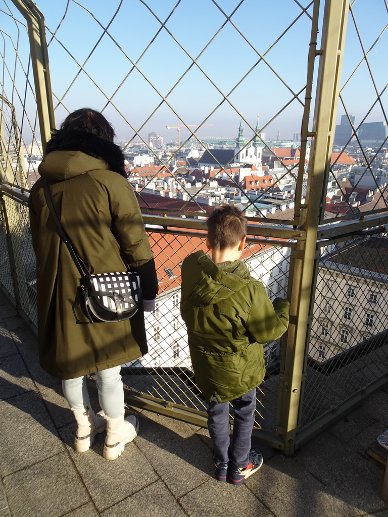 Miaomiao and Max at the viewing platform at the North Tower of St. Stephen`s Cathedral, with a view on the north side of the city with the Servitenkirche church