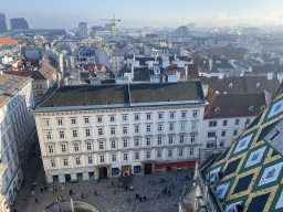 Northeast side of the Stephansplatz square, the northeast side of the city and the mosaic roof of St. Stephen`s Cathedral, viewed from the viewing platform at the North Tower