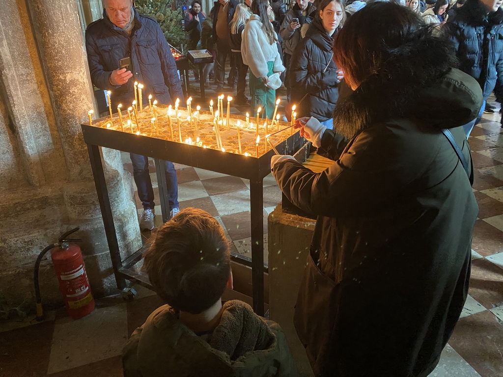 Miaomiao and Max lighting a candle at St. Stephen`s Cathedral