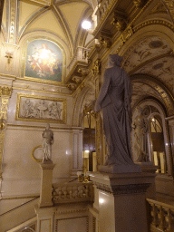 Statues at the upper floor of the Wiener Staatsoper building, with a view on the Grand Staircase