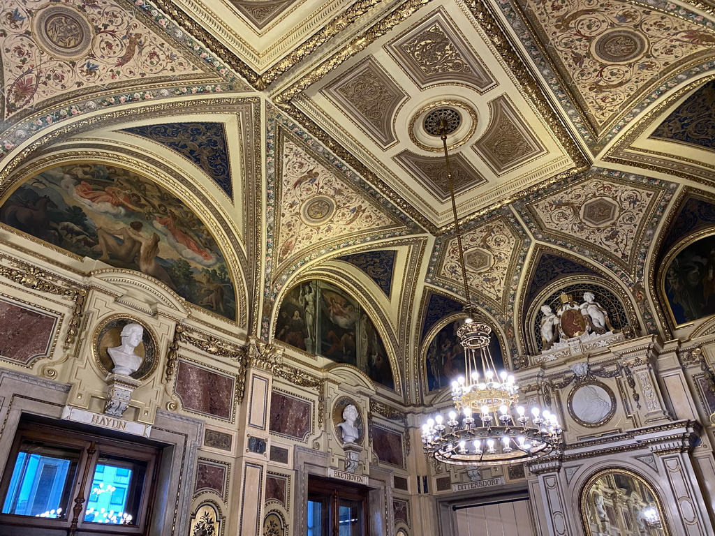 Busts, paintings and chandeleer at the Schwind Foyer at the upper floor of the Wiener Staatsoper building