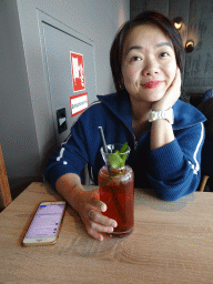 Miaomiao having a drink at the 360° Ocean Sky restaurant at the eleventh floor of the Haus des Meeres aquarium