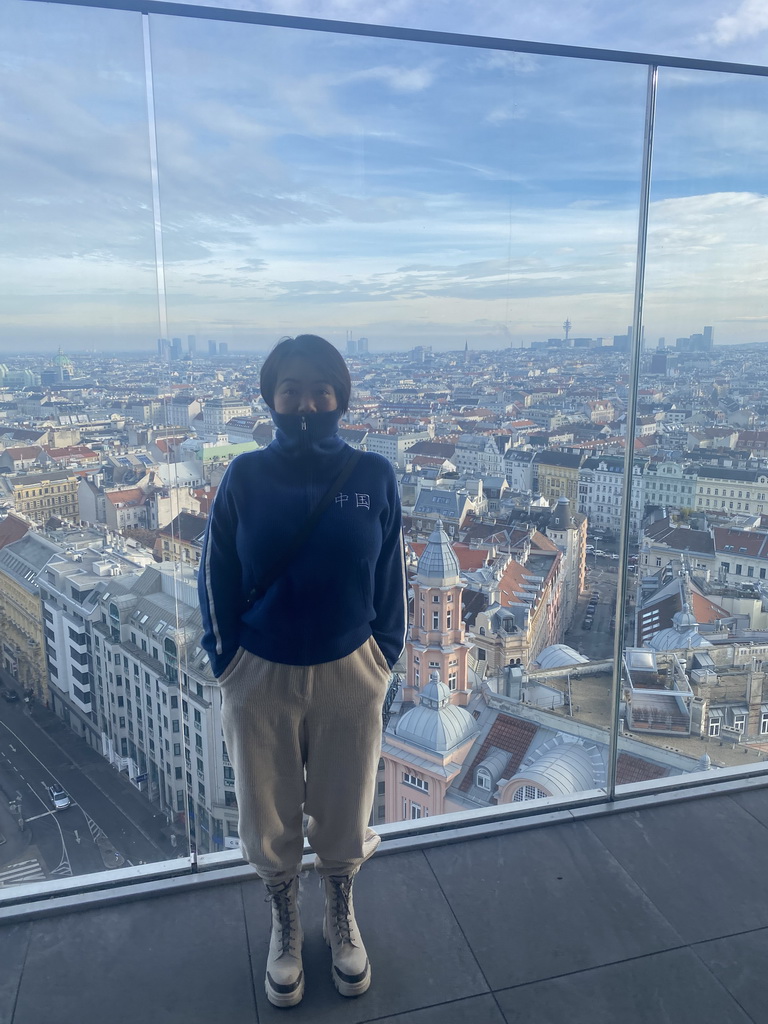 Miaomiao at the rooftop terrace at the eleventh floor of the Haus des Meeres aquarium, with a view on the east side of the city