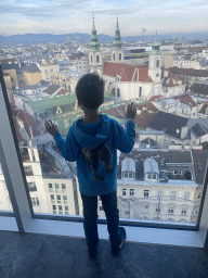 Max at the staircase from the tenth to the upper ninth floor of the Haus des Meeres aquarium, with a view on the city center with the Mariahilfer Kirche church