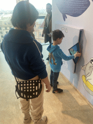 Miaomiao and Max playing a game at the `The Sea and Us` exhibition at the sixth floor of the Haus des Meeres aquarium