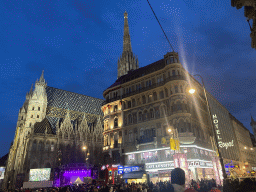 The Stock-im-Eisen-Platz square and the Stephansplatz square with a Silvesterpfad stage and the southwest side of St. Stephen`s Cathedral, at sunset
