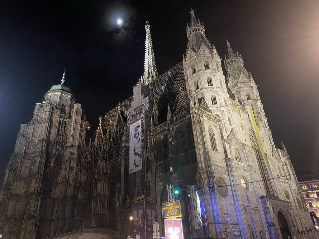 Northwest side of St. Stephen`s Cathedral, viewed from the Stephansplatz square, by night